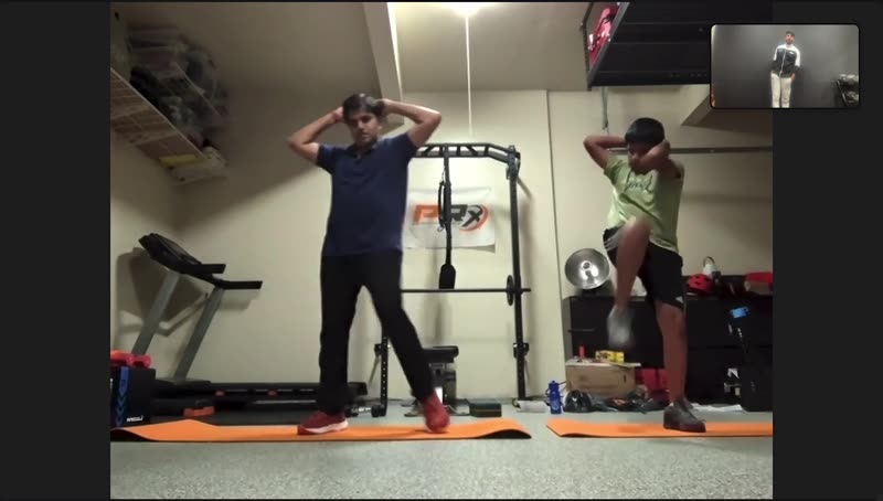 A father and son training together in a live session with Maddy